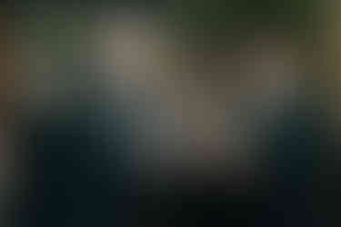 Groom giving a toast surrounded by friends at Brooklyn reception