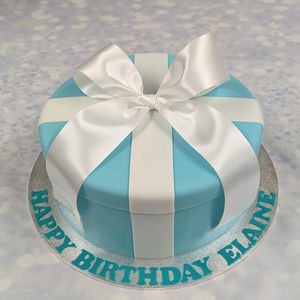 Round pale blue covered cake with a white satin bow on top. Tiffany style birthday cake . Bournemouth