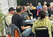 Leaders praying and chatting