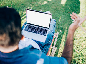 mortgage pro using laptop outdoors
