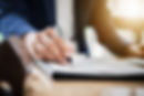Loan officer filling out adverse action notice