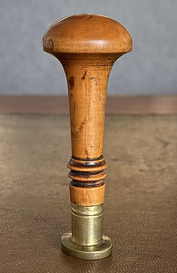 Antique nobility wax seal stamp in wood.