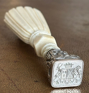 Antique wax seal engraved with the coats of arms of two noble families. One shield of Cognet family, and one shield of the de Brosse family. Nobility of France.