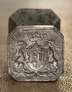 Monogram on old silver seal stamp of nobility.