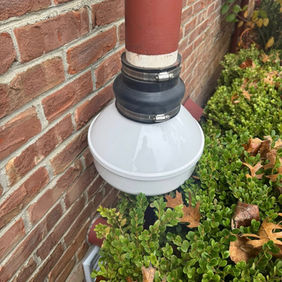 White rainwater diverter on downspout