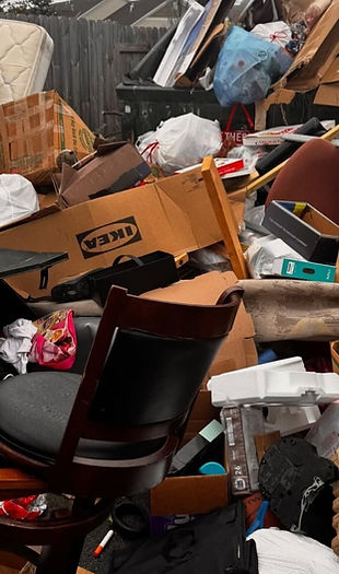 Large pile of discarded household junk