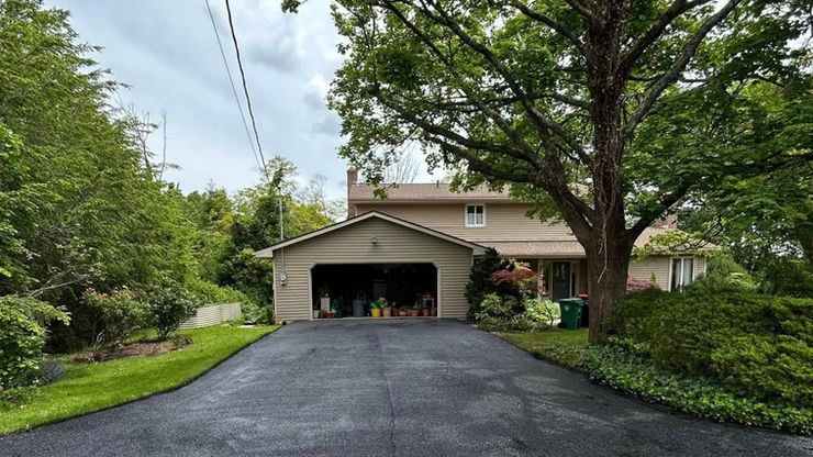 Two-story house with attached garage and driveway