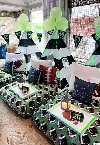 Football-themed teepee sleepover with team colors, goalpost decor, and game day vibes
