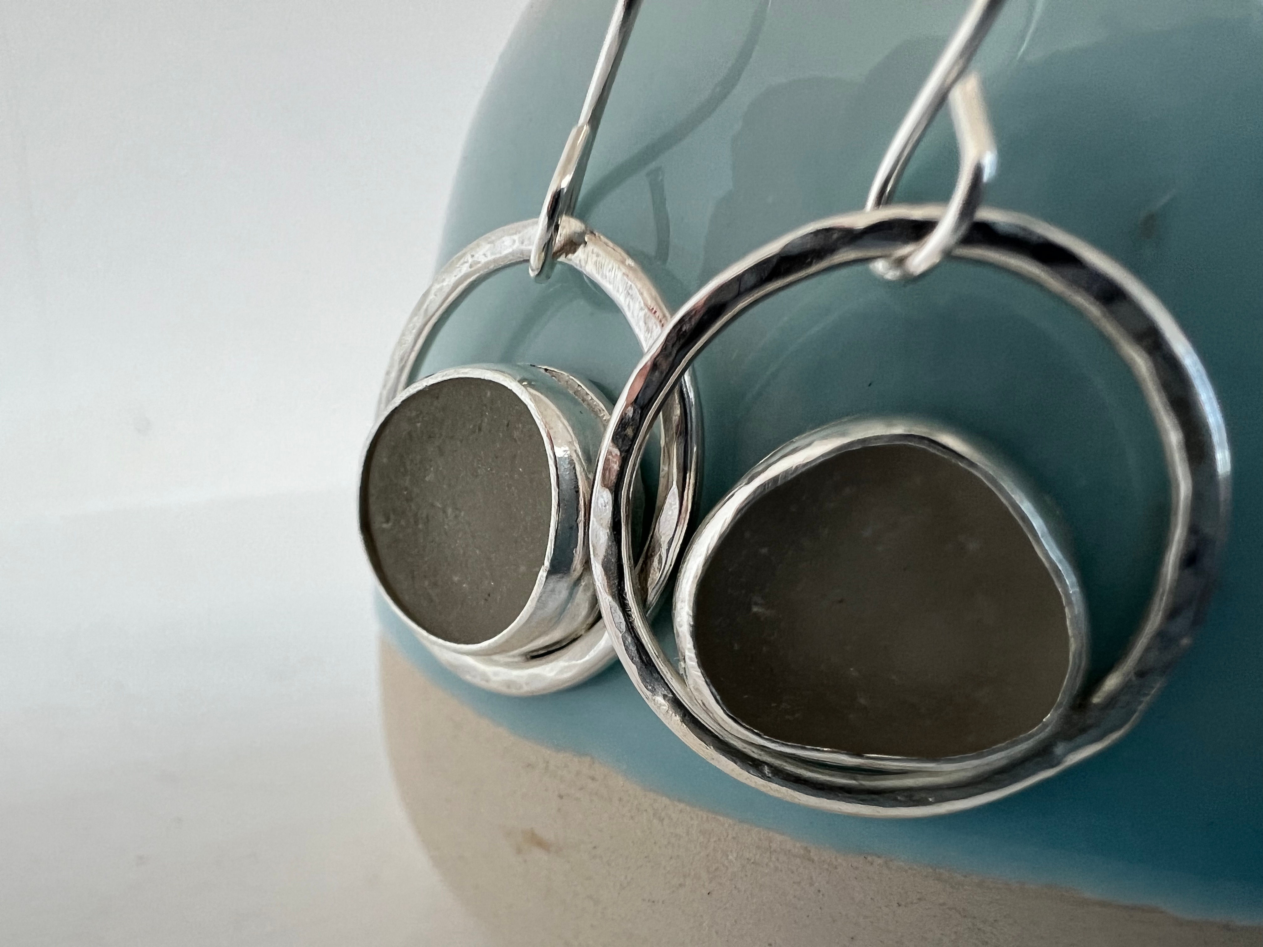 White sea glass set in a Sterling silver circle