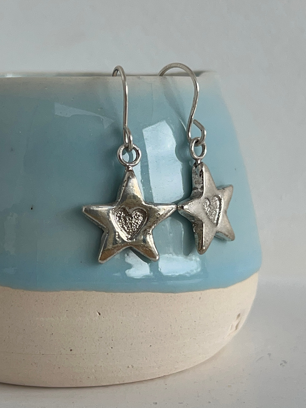 Chunky fine silver stars with embossed heart design