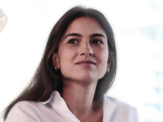 Person sitting calmly reflecting on boundaries and energy balance in their practice