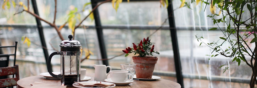 Coffee table in front of of a window