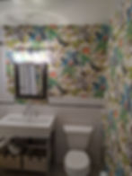 Small bath with bold floral wallpaper, console sink and toilet — NYC apartment bathroom update by Me