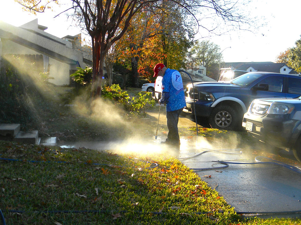 Pressure washing a driveway and front walkway