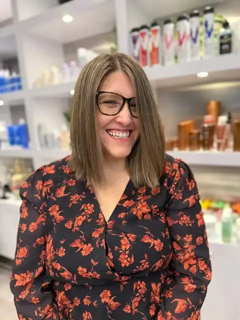 Front angle of shoulder-length blunt haircut with soft layers.