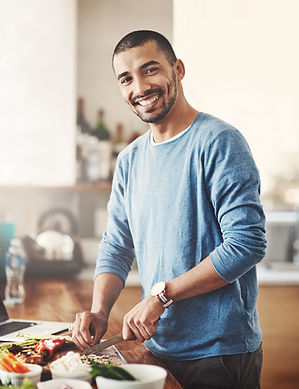 man cooking healthy foods