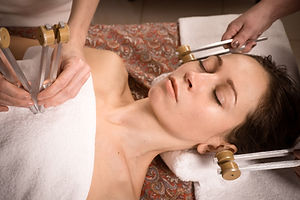 calm beautiful woman relax in spa. tuning forks sound healing therapy.jpg