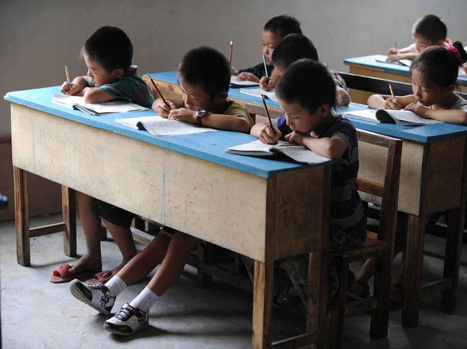 Chinese schoolchildren during lessons at a classroom in Hefei, east China's Anhui province, in 2010. STR/AFP/Getty Images