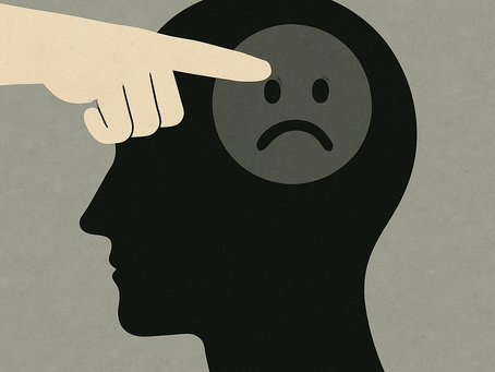 Silhouette of a head with a sad face symbol inside; a finger points at it. Neutral gray background, conveying a somber mood.