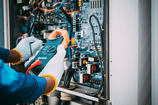 Technician is checking air conditioner refrigerant system maintenance and check switch boa