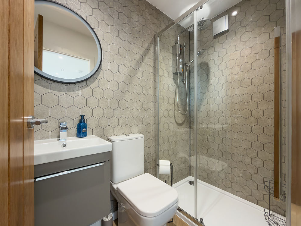 Luxury holiday pod benbecula bathroom with shower, toilet, sink.