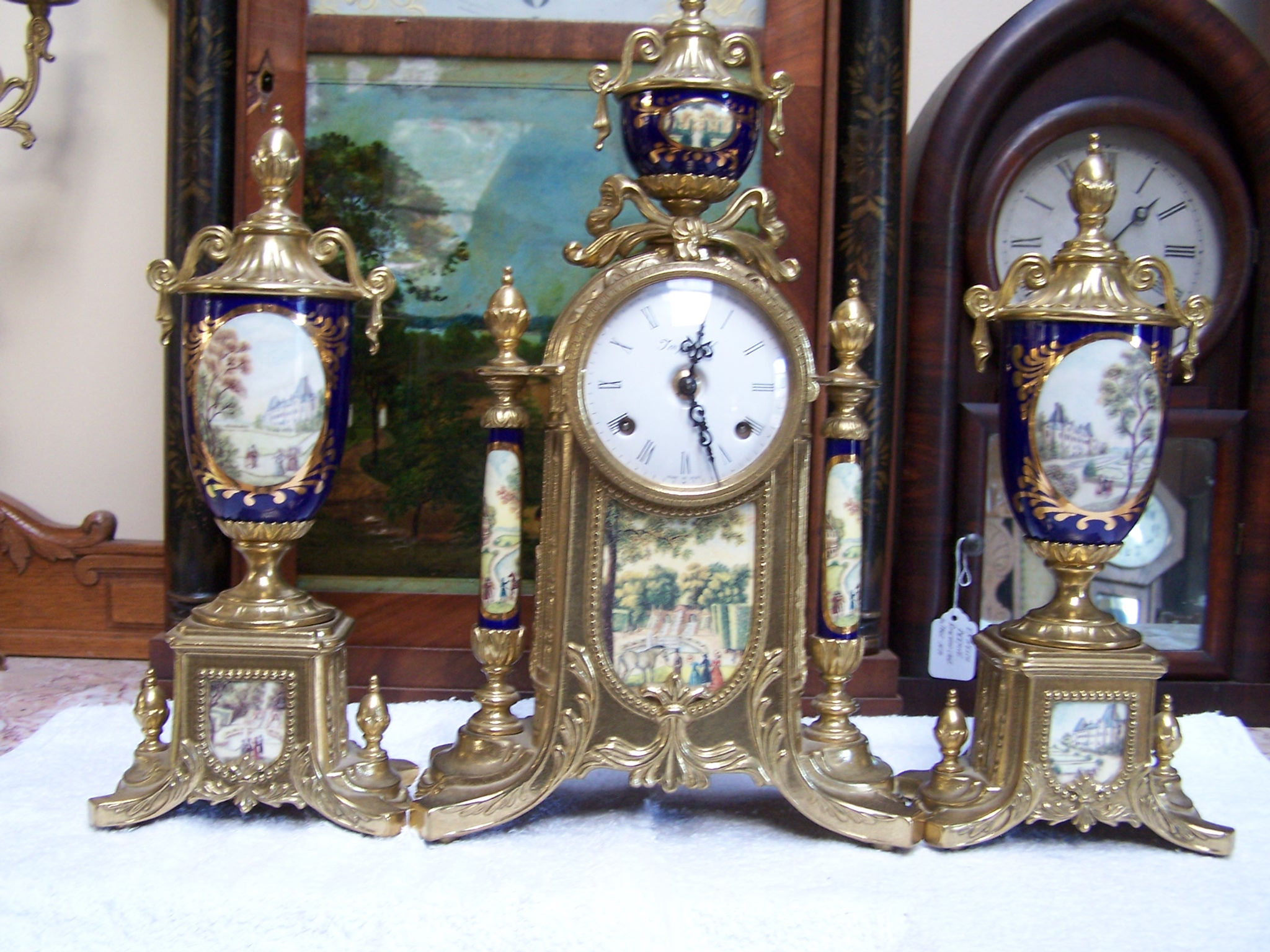 IMPERIAL CLOCK & MATCHED PAIR OF SIDE GARNITURES