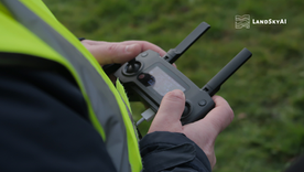 Autonomous drone conducting BVLOS security patrol over a large industrial facility at dusk, operating beyond visual line of sight under FAA authorization with remote operations center monitoring
