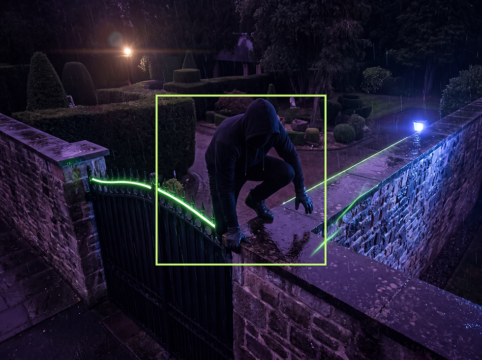 Night vision security footage showing a hooded figure in dark clothing climbing over a perimeter wal