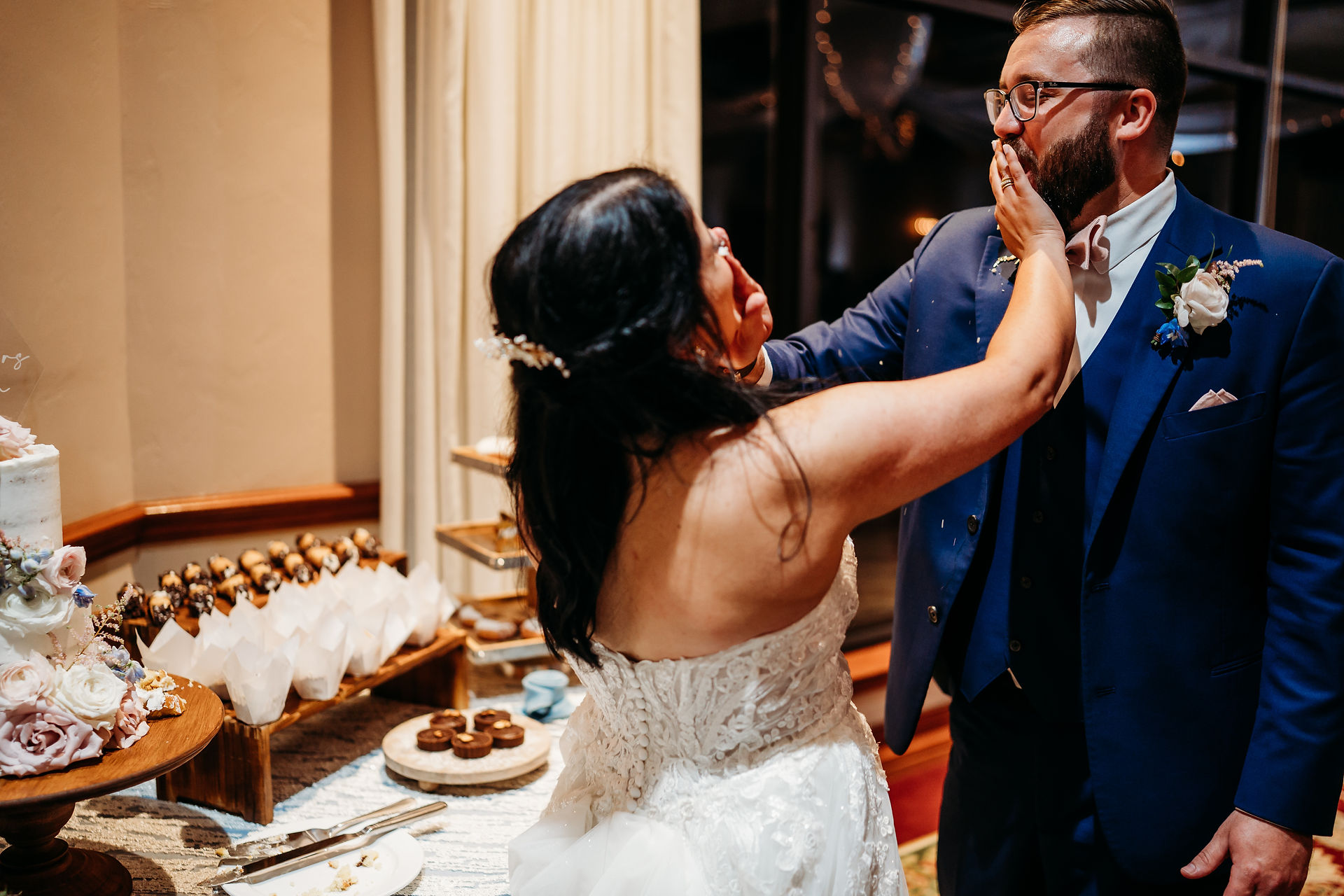 Couple smashing the cake