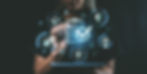 Person using tablet with health and insurance icons overlay, dark background, concept of d