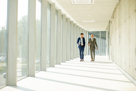 Business partners discussing matters while walking