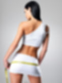 Rear view of sporty woman with slim body measuring hips - model posing in studio.jpg