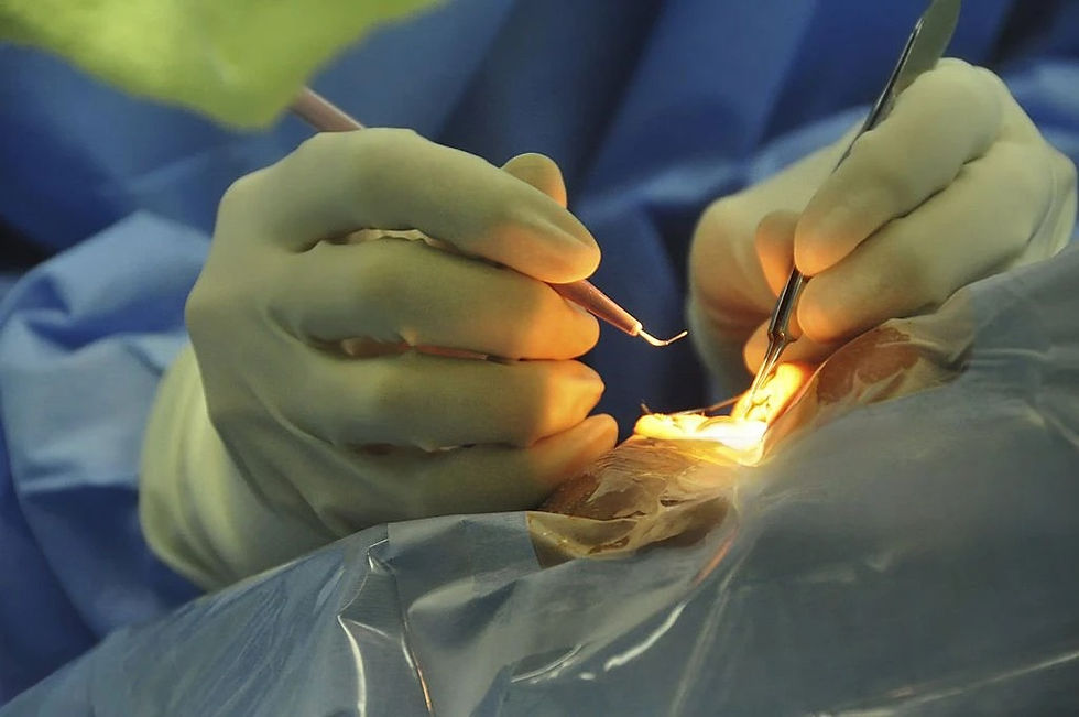 Close-up of gloved hands performing eye surgery