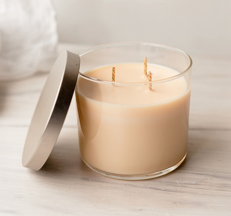 Luxe Flame three-wick scented candle in a glass jar