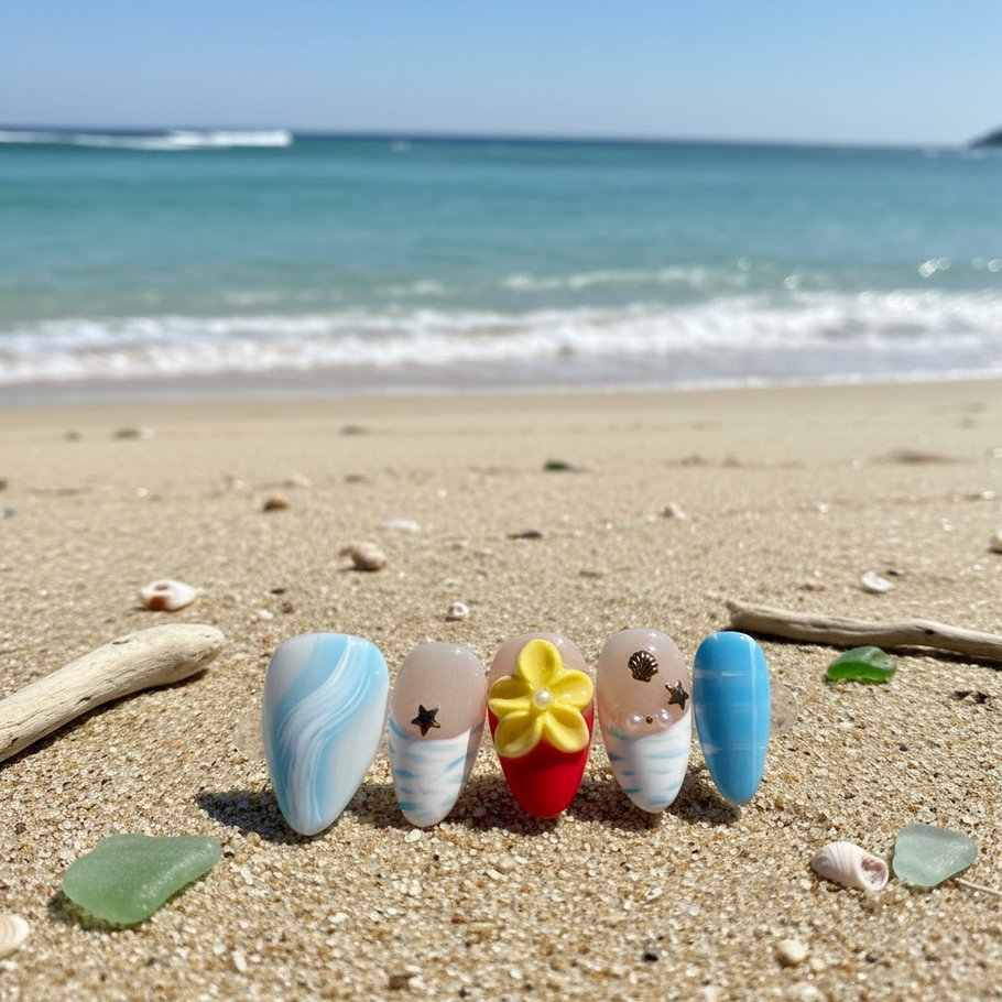 Tropical Tide press-on nails on a beach for summer.