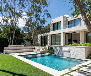 Luxury backyard pool with waterfall feature at a modern GTA home