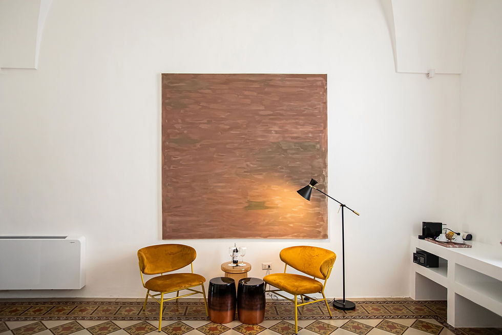 Panoramic view of the Terra Rossa Cosy room with details of the extra large artworks