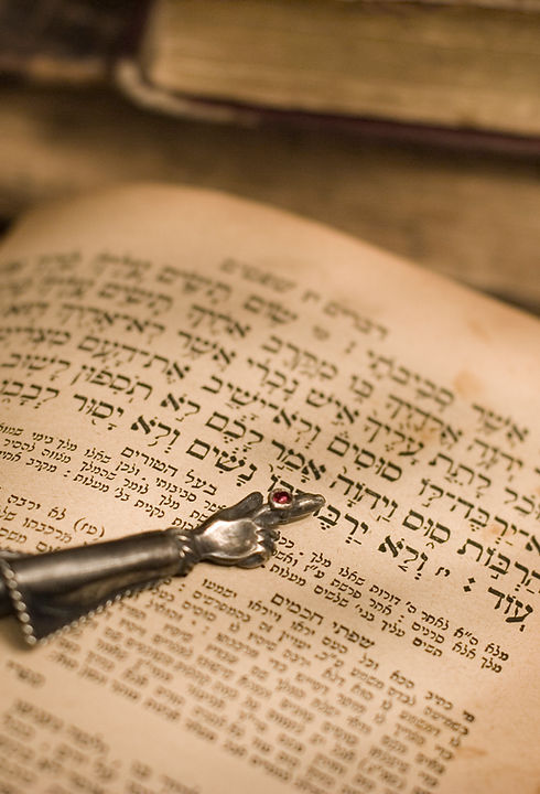 Old hebrew bible book with pointer