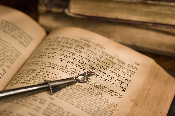 Old hebrew bible book with pointer