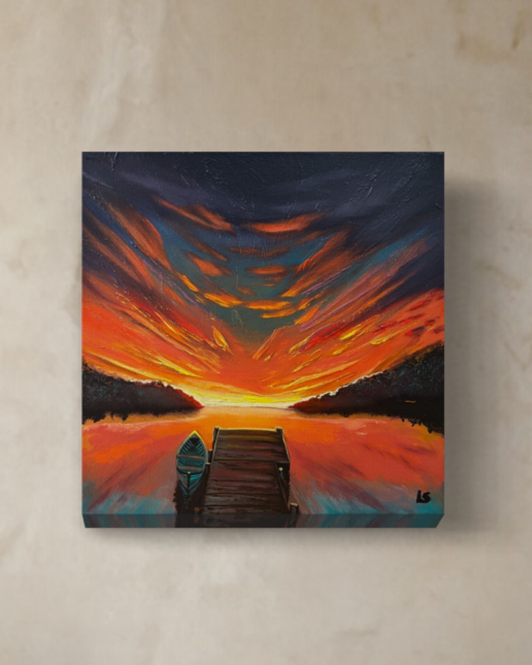 Lake sunset with canoe at a dock