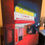 Thumbnail: Don't Run Oil Painting features the red glow of a movie theater by Luke Smith