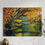 Thumbnail: A black bear wanders in front of a pond under a Texas live oak tree.