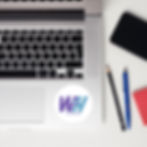 988 Wall Hugs logo sticker on laptop