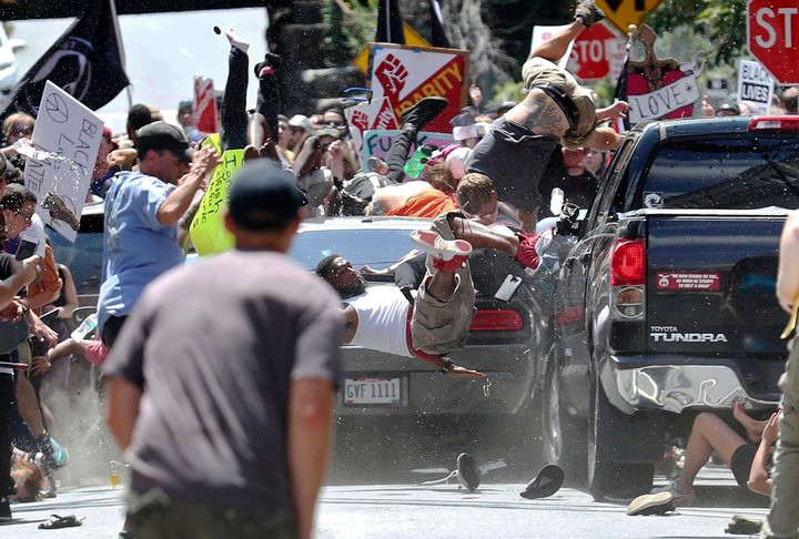 James Fields Jr drives his car through protestors after the "Unite the Right" rally in Charlottesville, injuring at least 19 and killing Heather Heyes.