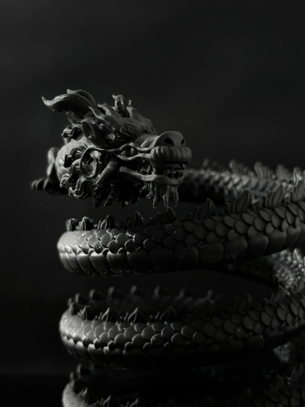 Pen stand that is in the shape of a dragon.