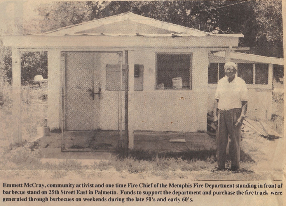 man stands next to a small building