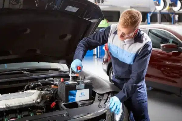 Honda auto repair services at Santa Ana Auto Care in Houston, TX, with a mechanic working on a Honda vehicle.