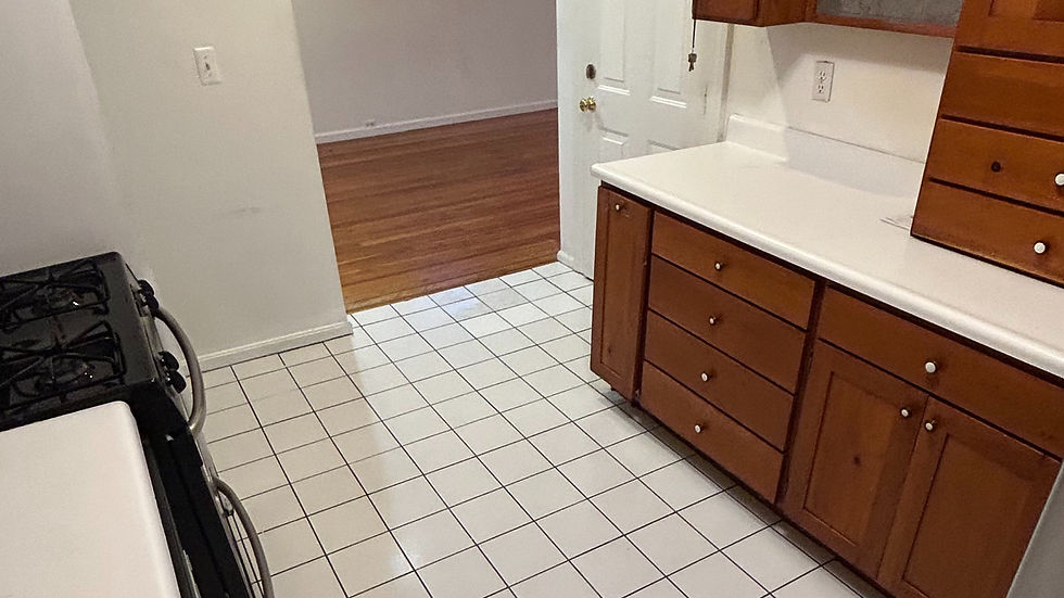 High angle view of a professional cleaner polishing a kitchen countertop