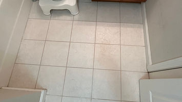 Freshly cleaned tile bathroom floor
