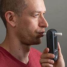 Man taking a breath alcohol test